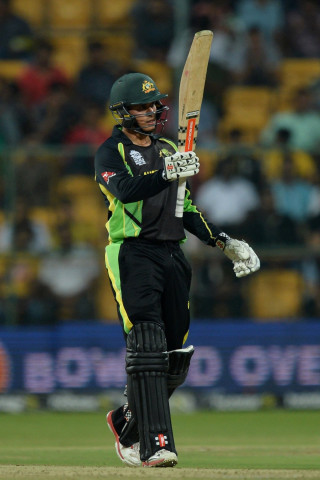 australian batsman usman khawaja raises his bat after scoring 50 runs during the world t20 cricket tournament match between australia and bangladesh at the chinnaswamy stadium in bangalore on march 21 2016 photo afp australian batsman usman khawaja raises his bat after scoring 50 runs during the world t20 cricket tournament match between australia and bangladesh at the chinnaswamy stadium in bangalore on march 21 2016 photo afp