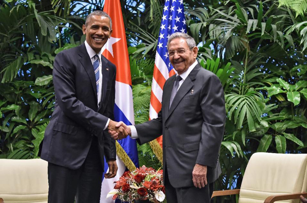 us president barack obama l and cuban president raul castro shake hands during a meeting at the revolution palace in havana on march 21 2016 photo afp