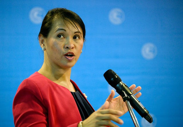 anti money laundering council amlc executive director julia abad gestures during a press conference at the central bank of the philippines headquarters in manila on march 22 2016 photo afp