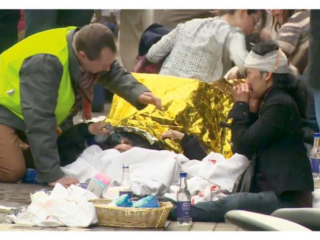 rescuers treat victims outside the maelbeek metro station in brussels photo reuters rescuers treat victims outside the maelbeek metro station in brussels photo reuters