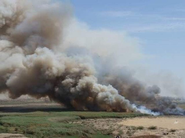 picture shows huge fire engulfing bushes in an open field near korangi causeway photo express picture shows huge fire engulfing bushes in an open field near korangi causeway photo express
