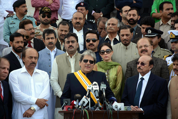 on 23rd march pakistan day governor ishrat ul ibad along others addressing at tomb of quaid e azam photo express