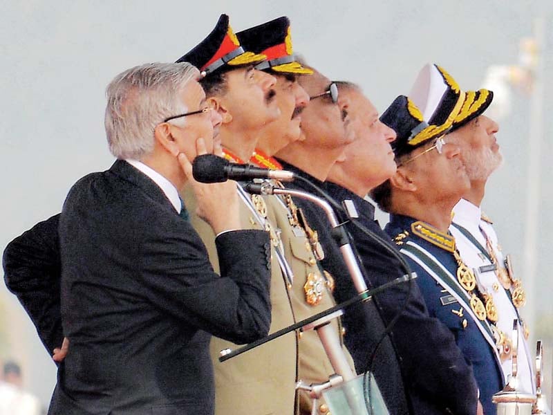 women officers march during the pakistan day parade l civil and military leaders watch a fly past of paf jets photos afp nni