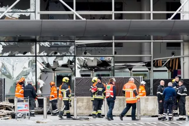 staff members at brussels national airport and rescuers stand outside the terminal for a ceremony following bomb attacks in brussels metro and belgium 039 s national airport of zaventem belgium march 23 2016 photo reuters staff members at brussels national airport and rescuers stand outside the terminal for a ceremony following bomb attacks in brussels metro and belgium 039 s national airport of zaventem belgium march 23 2016 photo reuters