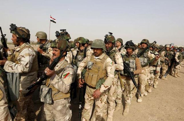 iraqi security forces wait for vehicles travelling to mosul to fight against militants of islamic state at an iraqi army base in camp taji in baghdad february 21 2016 photo reuters