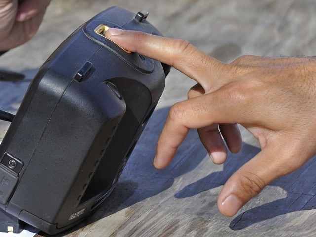 in the guise of ngo workers the men took fingerprints for sims photo afp