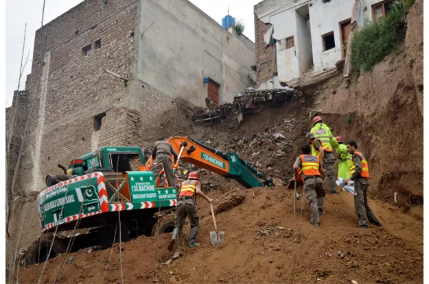 rescue officials busy in rescue operation after house collapse in peshawar photo ppi