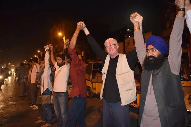 nsf activists form a symbolic human chain to express solidarity with hindus during holi celebrations outside swami narayan mandar in karachi photo nsf karachi nsf activists form a symbolic human chain to express solidarity with hindus during holi celebrations outside swami narayan mandar in karachi photo nsf karachi