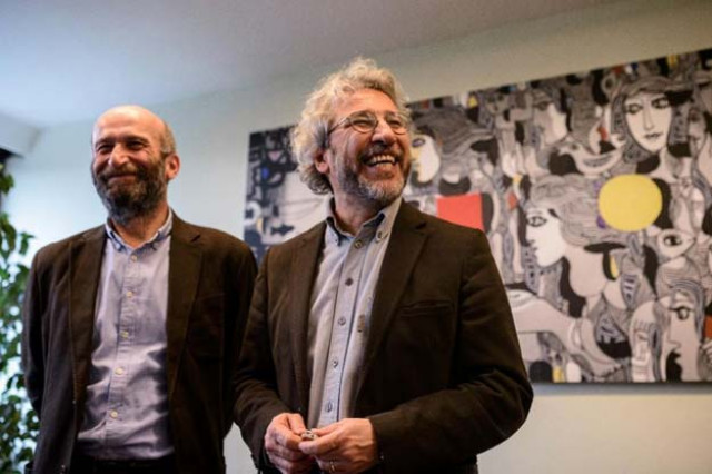 can dundar r editor in chief of the cumhuriyet newspaper and erdem gul l his ankara bureau chief are due in court in istanbul on charges of revealing state secrets photo afp can dundar r editor in chief of the cumhuriyet newspaper and erdem gul l his ankara bureau chief are due in court in istanbul on charges of revealing state secrets photo afp