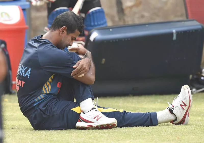 sri lanka s nuwan kulasekara stretches during a training session on the eve of their must win match against england at the feroz shah kotla cricket ground in new delhi photo afp sri lanka s nuwan kulasekara stretches during a training session on the eve of their must win match against england at the feroz shah kotla cricket ground in new delhi photo afp