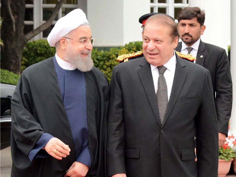 nawaz sharif welcomes iranian president hassan rowhani at the pm house in islamabad photo afp