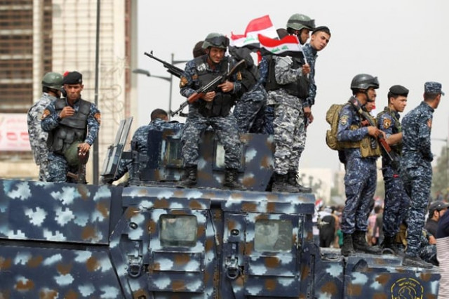 iraqi security forces stand guard during a protest on march 25 2016 outside the main gates of baghdad 039 s green zone photo afp iraqi security forces stand guard during a protest on march 25 2016 outside the main gates of baghdad 039 s green zone photo afp