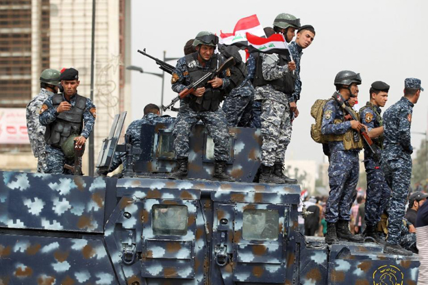 iraqi security forces stand guard during a protest on march 25 2016 outside the main gates of baghdad 039 s green zone photo afp