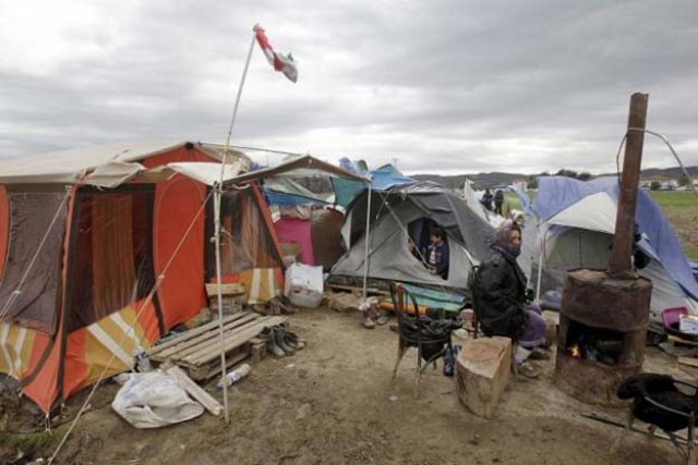 a refugee sits next to her tent in a makeshift camp for refugees and migrants at the greek macedonian border near the village of idomeni greece march 24 2016 reuters a refugee sits next to her tent in a makeshift camp for refugees and migrants at the greek macedonian border near the village of idomeni greece march 24 2016 reuters
