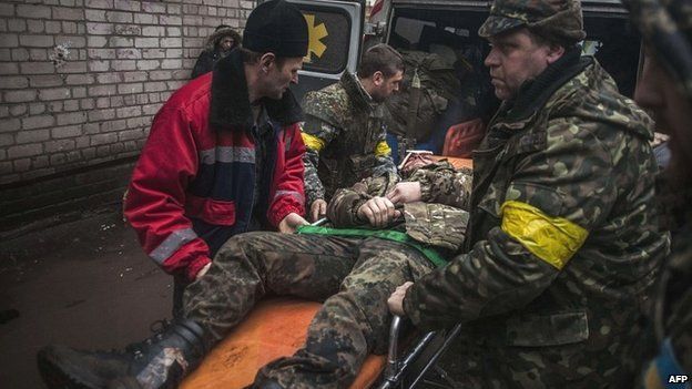 a file photo of a ukrainian soldier being taken to medical facility photo afp