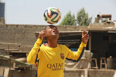 from the green of a football field to the harsh road