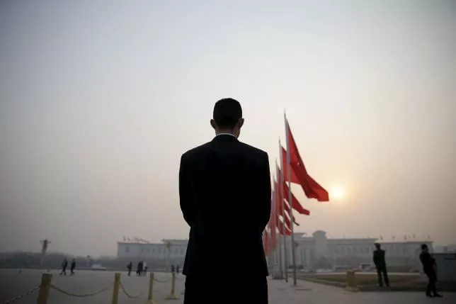 a security agent stands guard near the great hall of the people as the sun appears through smog ahead of the closing ceremony of china 039 s national people 039 s congress npc in beijing china march 16 2016 photo reuters a security agent stands guard near the great hall of the people as the sun appears through smog ahead of the closing ceremony of china 039 s national people 039 s congress npc in beijing china march 16 2016 photo reuters