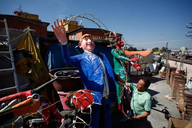 craftsman felipe linares puts the final touch to an effigy depicting republican u s presidential candidate donald trump at his workshop before it being burnt as the symbolic figure of the biblical character of judas as part of holy week celebrations in mexico city photo reuters craftsman felipe linares puts the final touch to an effigy depicting republican u s presidential candidate donald trump at his workshop before it being burnt as the symbolic figure of the biblical character of judas as part of holy week celebrations in mexico city photo reuters