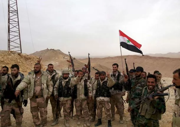 forces loyal to syria 039 s president bashar al assad flash victory signs and carry a syrian national flag on the edge of the historic city of palmyra in homs governorate in this handout picture provided by sana on march 26 2016 photo reuters forces loyal to syria 039 s president bashar al assad flash victory signs and carry a syrian national flag on the edge of the historic city of palmyra in homs governorate in this handout picture provided by sana on march 26 2016 photo reuters