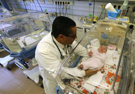 mohamed abdulrahman abdulrab a yemeni born hungarian doctor who was voted quot doctor of the year quot by hungarian patients examines a new born baby at the hospital in gyula hungary march 23 2016 photo reuters