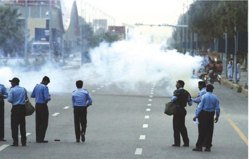 police fire tear gas at the protesters photo waseem nazir express