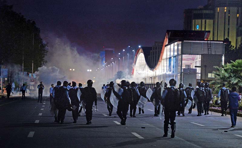 riot police confronts protesters near the metro station in islamabad photo afp