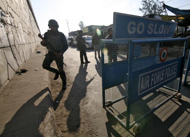 indian security personnel stand guard next to a barricade outside the indian air force iaf base at pathankot in punjab india january 2 2016 photo reuters