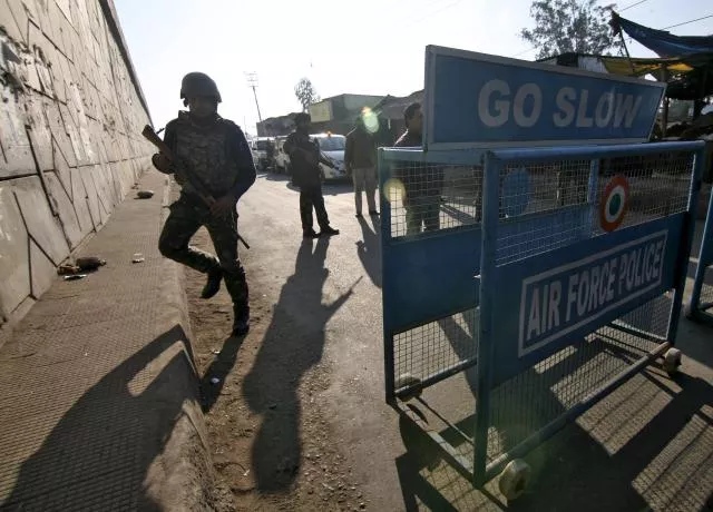 indian security personnel stand guard next to a barricade outside the indian air force iaf base at pathankot in punjab india january 2 2016 photo reuters indian security personnel stand guard next to a barricade outside the indian air force iaf base at pathankot in punjab india january 2 2016 photo reuters