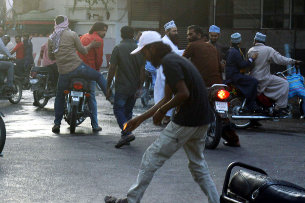 attackers putting fire outside karachi press club photo express