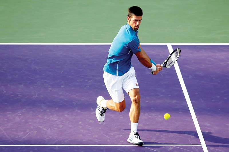 djokovic returns a shot to sousa during their miami open third round match photo afp