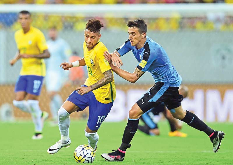 neymar was cautioned for a petulant kick on alvaro gonzalez and is set to miss brazil s trip to paraguay along with david luiz photo afp