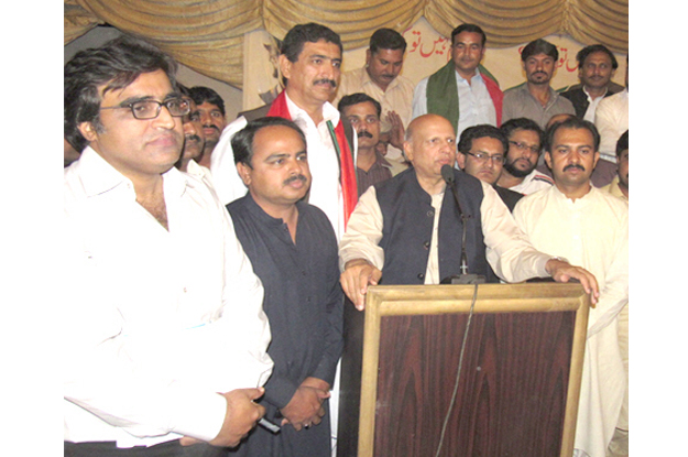 pakistan tehreek i insaf pti leader and former governor chaudhry sarwar speaking to pti workers photo express
