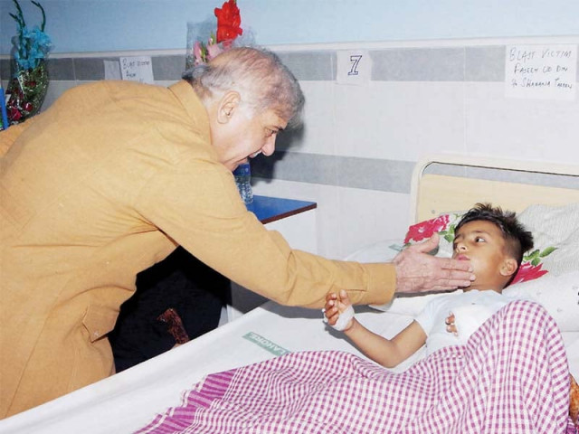 chief minister shahbaz sharif visits a child admitted at jinnah hospital top relatives gather around the coffin of a deceased above photo wires chief minister shahbaz sharif visits a child admitted at jinnah hospital top relatives gather around the coffin of a deceased above photo wires