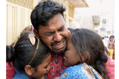 lahore attack anguished families bury their dead