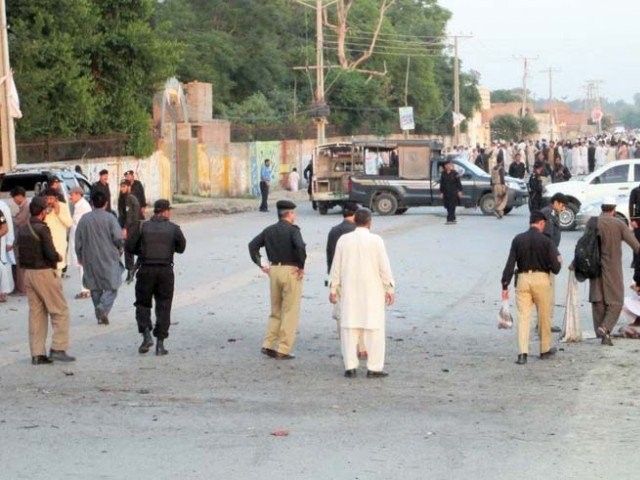 security officials cordon off the site of the suicide attack on aftab khan sherpao in charsadda photo afp