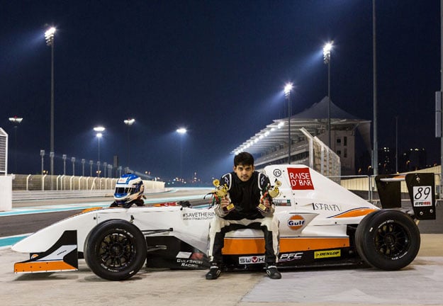 this photograph taken on march 28 2014 shows pakistani race car driver saad ali posing with his awards at the yas marina formula 1 circuit in abu dhabi uae saad ali is in pole position in the race to become pakistan 039 s first formula 1 driver a seemingly impossible goal in a country with no training facilities and where most sponsorship money is poured in to cricket photo afp