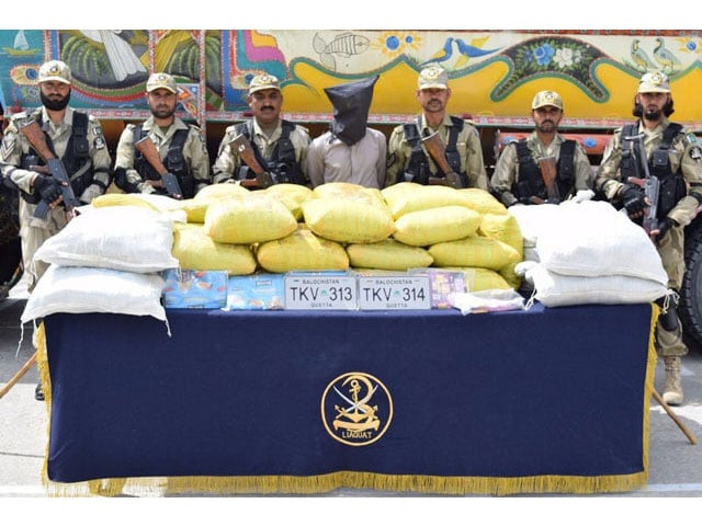 in this file photo pakistan coast guard personnel pose with the arrested driver and seized narcotics photo faraz khan express in this file photo pakistan coast guard personnel pose with the arrested driver and seized narcotics photo faraz khan express
