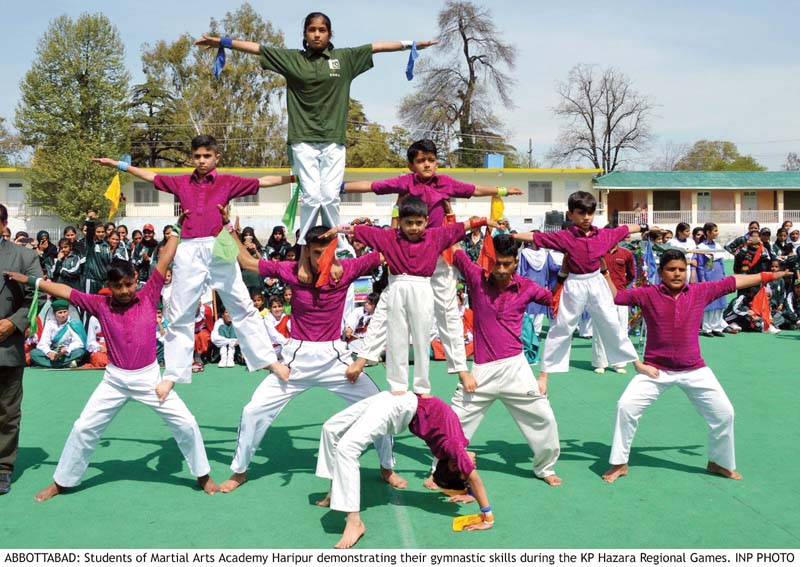 students of martial arts academy show their gymnastic skills at the hockey stadium in abbottabad photo inp