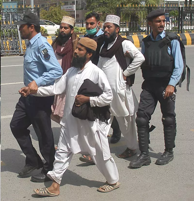 police walk off three protesters photo waseem nazir express police walk off three protesters photo waseem nazir express
