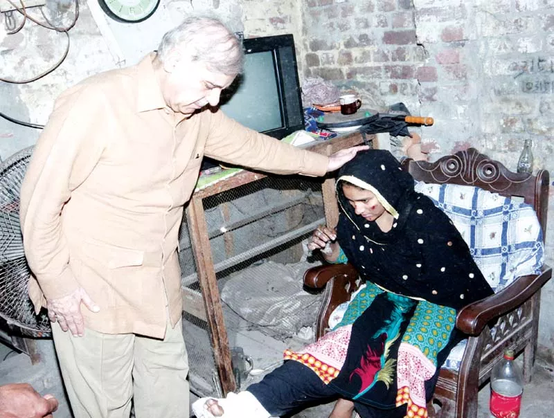 chief minister shahbaz sharif visits an injured girl at her home photo pr chief minister shahbaz sharif visits an injured girl at her home photo pr