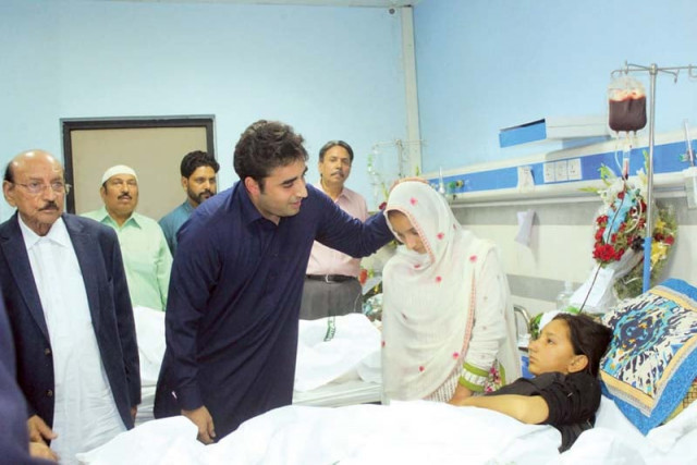 ppp chairman bilawal bhutto and sindh cm qaim ali shah enquire after the health of an injured girl photo express ppp chairman bilawal bhutto and sindh cm qaim ali shah enquire after the health of an injured girl photo express