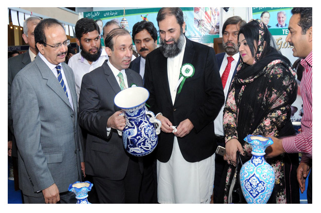 tevta chairperson irfan qaiser sheikh is briefing the state minister for education baligh ur rehman about the projects prepared by tevta students photo inp