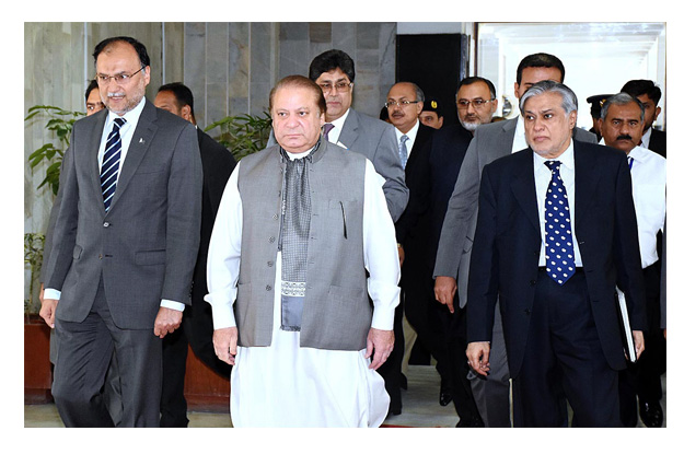 pm nawaz sharif being received by minister for planning and development ahsan iqbal at the ministry of planning development photo app