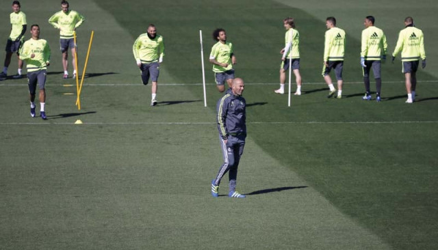 zidane overlooks a training session at real madrid sport city in madrid on the eve of el clasico the frenchman was involved in several clasicos as a player but today s clash will be his first as a manager photo reuters zidane overlooks a training session at real madrid sport city in madrid on the eve of el clasico the frenchman was involved in several clasicos as a player but today s clash will be his first as a manager photo reuters