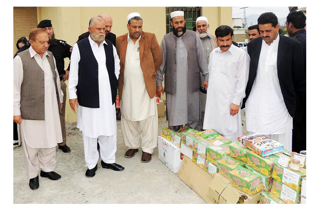 adviser to the chief minister on food qalandar khan lodhi examining substandard food products at district food controller office photo online