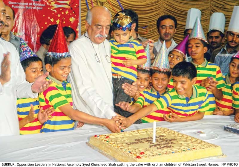 national assembly opposition leader khursheed ahmed shah cuts the cake with the orphans of sweet home in sukkur on thursday evening eight children celebrated their birthday on the occasion photo inp