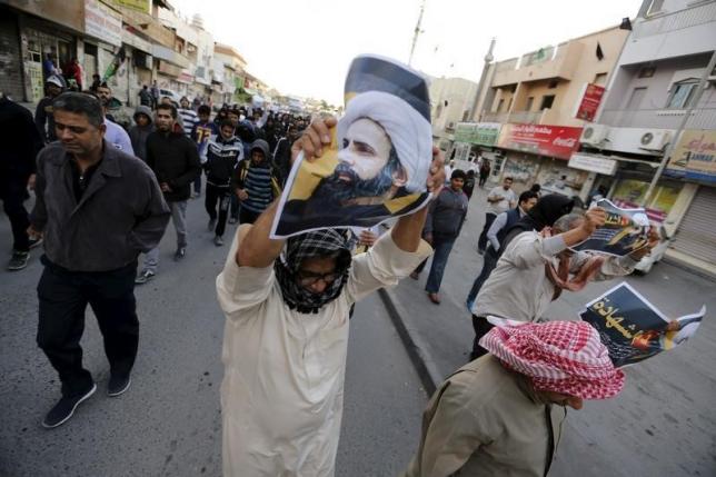 protesters holding poster of saudi shi 039 ite cleric nimr al nimr protest against his execution by saudi authorities in the village of sanabis west of manama bahrain january 3 2016 photo reuters
