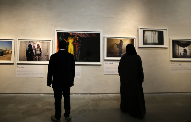 visitors look at images taken by jordanian photographer tanya habjouqa of syrian refugees during a joint exhibition along with syrian artist omar imam on refugees and migrants fleeing war and poverty on march 10 2016 in dubai the exhibition also pays tribute to photographer leila alaoui who was among dozens killed in a january attack claimed by al qaeda on a hotel in burkina faso photo afp visitors look at images taken by jordanian photographer tanya habjouqa of syrian refugees during a joint exhibition along with syrian artist omar imam on refugees and migrants fleeing war and poverty on march 10 2016 in dubai the exhibition also pays tribute to photographer leila alaoui who was among dozens killed in a january attack claimed by al qaeda on a hotel in burkina faso photo afp