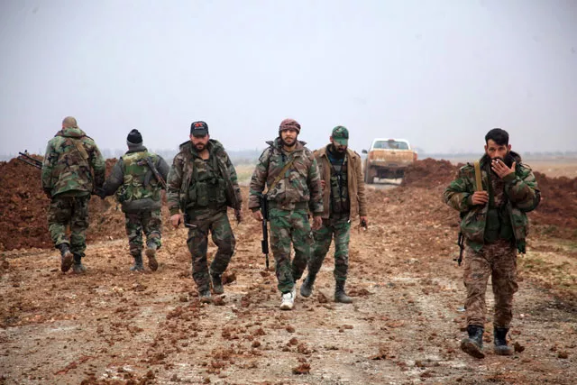 syrian regime forces walk in an area south of the town of al bab in the northern province of aleppo on january 14 2016 photo afp syrian regime forces walk in an area south of the town of al bab in the northern province of aleppo on january 14 2016 photo afp
