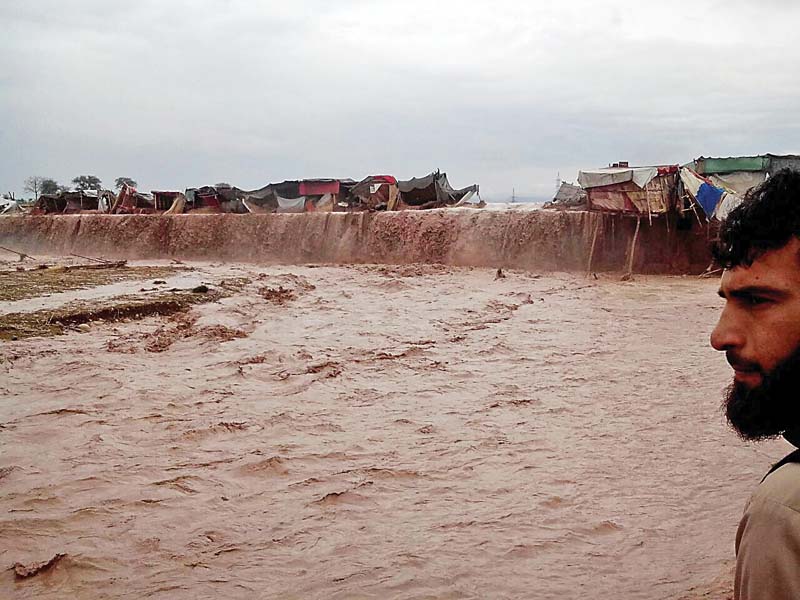 more than three dozen shops washed away in battathal bara sheikhan in the city on sunday the district administration asked people settled there to evacuate photo ahtesham khan express